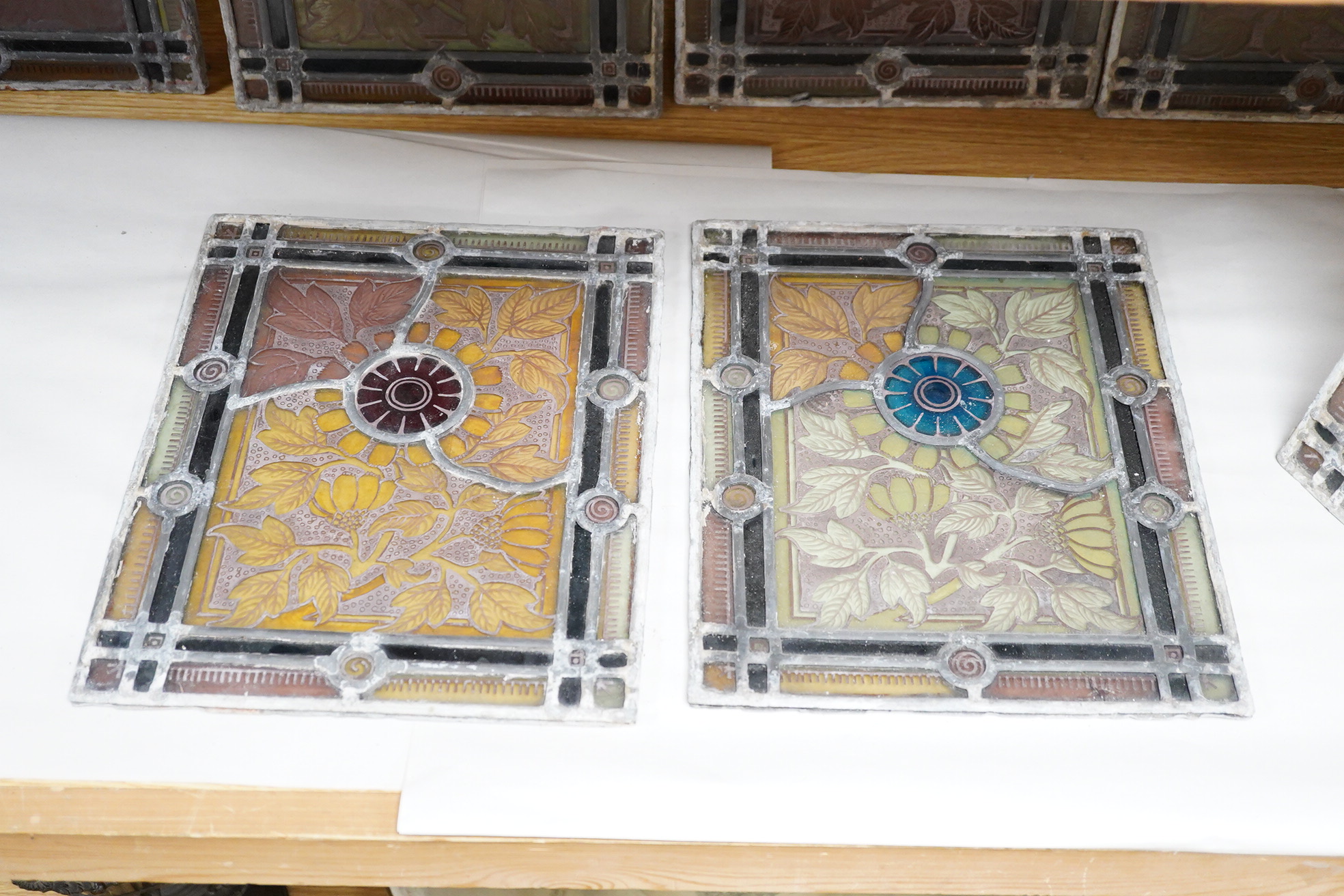 A set of eight late 19th century leaded stained glass panels, 23cm x 28cm